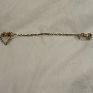 This is a rare Antique signed  Elizabeth Morrey  sweater clip.